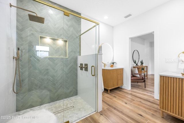 1313 Worth Ct NE, Palm Bay, FL 32905 - full bath with vanity, wood finished floors, and a stall shower