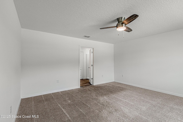 2205 Sapelo Ave SE, Palm Bay, FL 32909 - carpeted empty room with a ceiling fan, a textured ceiling, and baseboards