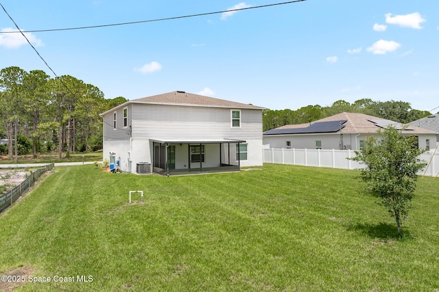 2205 Sapelo Ave SE, Palm Bay, FL 32909 - rear view of property featuring a sunroom and central AC
