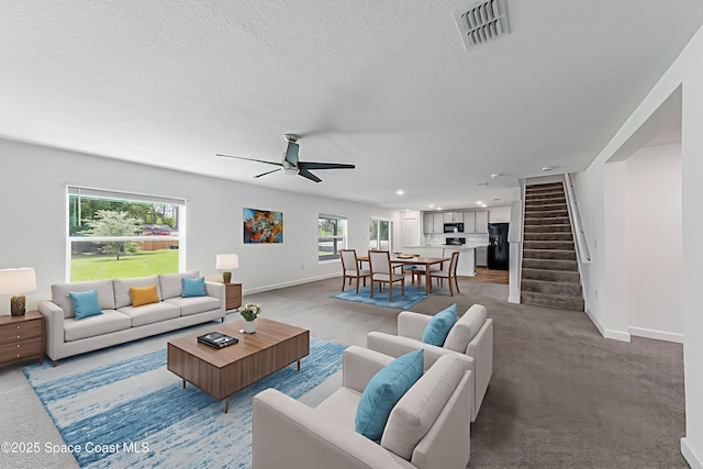 2205 Sapelo Ave SE, Palm Bay, FL 32909 - living room with stairway, ceiling fan, baseboards, recessed lighting, and a textured ceiling
