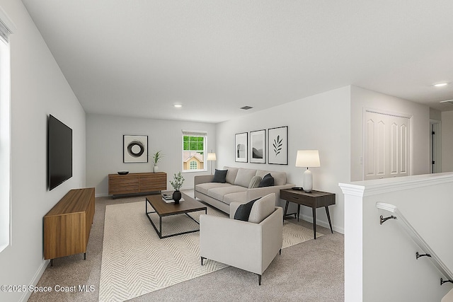 2205 Sapelo Ave SE, Palm Bay, FL 32909 - living area featuring light colored carpet, baseboards, and recessed lighting