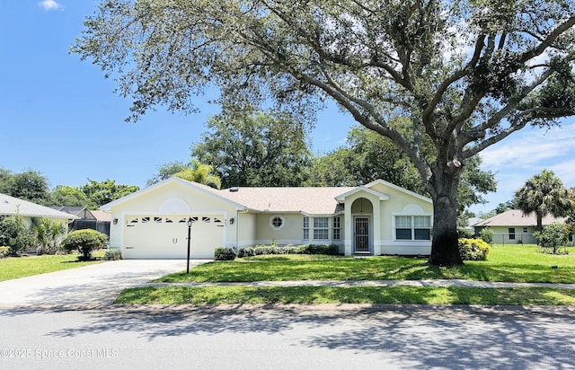 803 Crossbow Dr, West Melbourne, FL 32904 - ranch-style house featuring an attached garage, driveway, a front yard, and stucco siding
