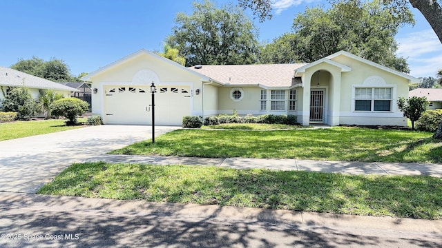 803 Crossbow Dr, West Melbourne, FL 32904 - single story home featuring a garage, driveway, a front yard, and stucco siding