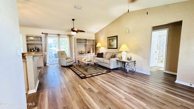 803 Crossbow Dr, West Melbourne, FL 32904 - living area with a ceiling fan, wood finished floors, baseboards, and high vaulted ceiling