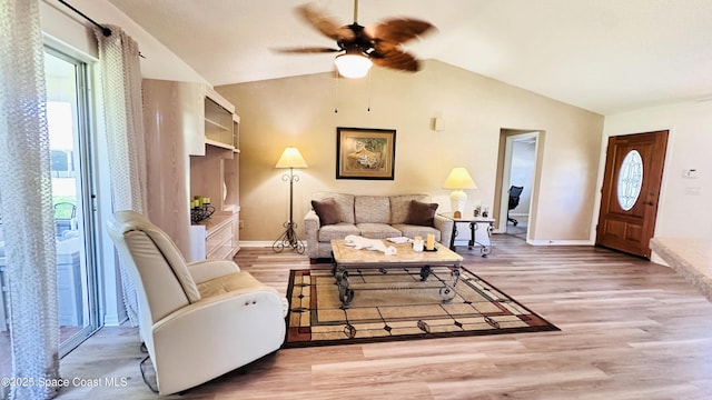 803 Crossbow Dr, West Melbourne, FL 32904 - living room with a ceiling fan, lofted ceiling, wood finished floors, and baseboards