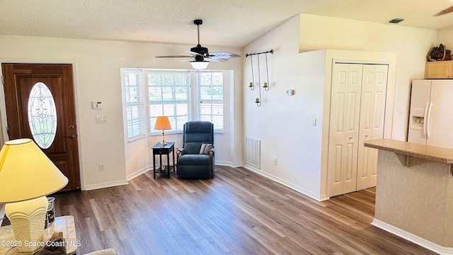 803 Crossbow Dr, West Melbourne, FL 32904 - sitting room with a ceiling fan, wood finished floors, a textured ceiling, and baseboards