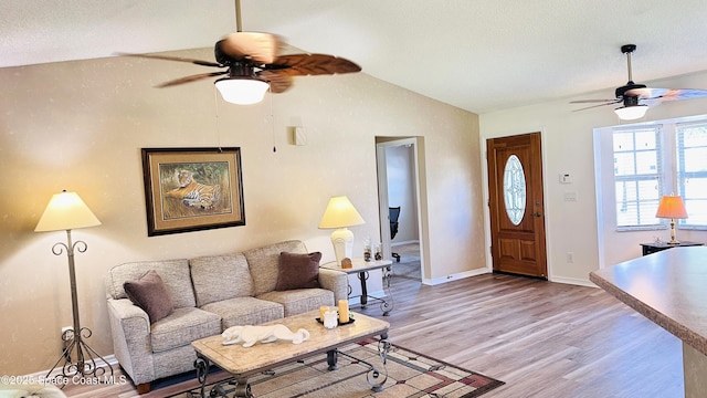 803 Crossbow Dr, West Melbourne, FL 32904 - living room with a ceiling fan, vaulted ceiling, light wood-style flooring, and baseboards