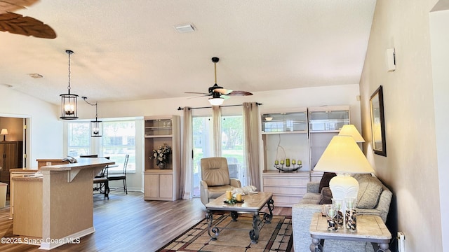 803 Crossbow Dr, West Melbourne, FL 32904 - living area featuring wood finished floors, a ceiling fan, and a textured ceiling