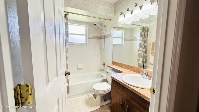803 Crossbow Dr, West Melbourne, FL 32904 - bathroom featuring shower / bath combination with curtain, toilet, vanity, and wood finished floors
