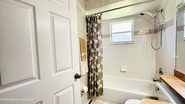 803 Crossbow Dr, West Melbourne, FL 32904 - bathroom featuring shower / bathtub combination with curtain and toilet