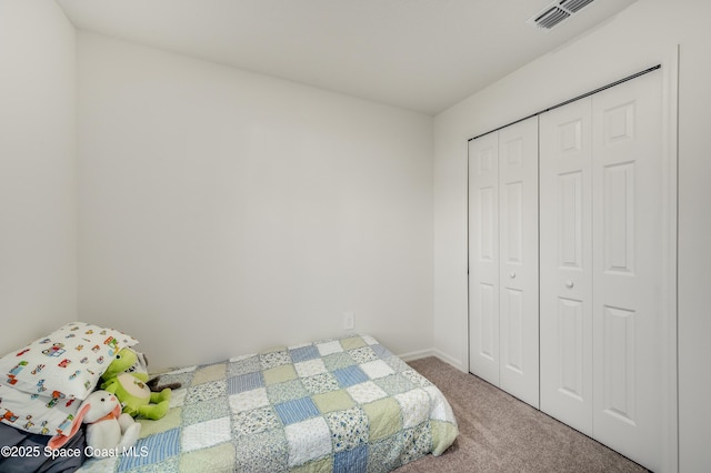 499 Grenadier Ave NW, Palm Bay, FL 32907 - bedroom featuring carpet flooring, a closet, and baseboards