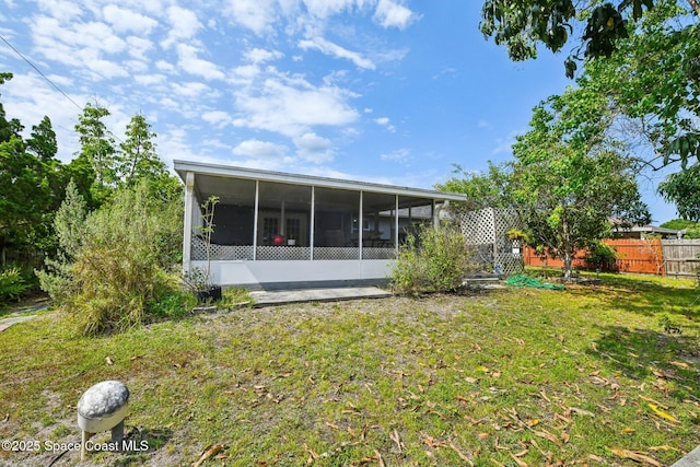1060 Hosbine St SE, Palm Bay, FL 32909 - rear view of property with a sunroom