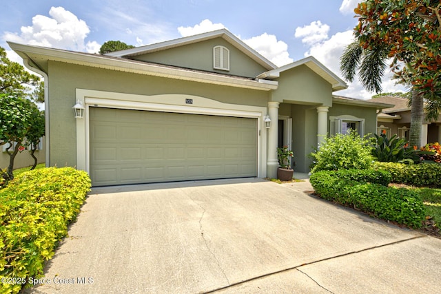 858 Morning Cove Cir SE, Palm Bay, FL 32909 - view of front facade with stucco siding, a garage, and driveway