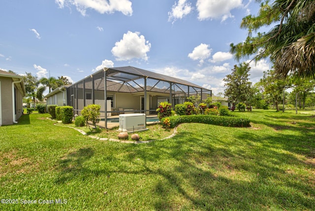 858 Morning Cove Cir SE, Palm Bay, FL 32909 - back of property with a yard, an outdoor pool, and a lanai
