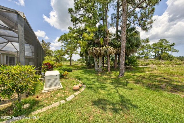 858 Morning Cove Cir SE, Palm Bay, FL 32909 - view of grassy yard with glass enclosure