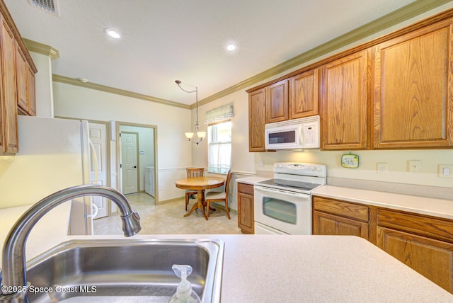 858 Morning Cove Cir SE, Palm Bay, FL 32909 - kitchen with white appliances, crown molding, brown cabinets, light countertops, and a sink