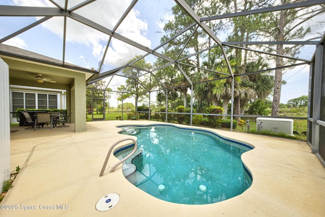 858 Morning Cove Cir SE, Palm Bay, FL 32909 - outdoor pool featuring a patio, glass enclosure, outdoor dining area, and ceiling fan