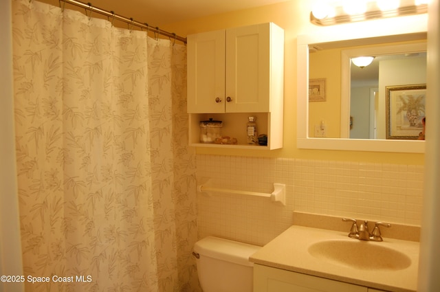 2020 N Atlantic Ave Unit 508-N, Cocoa Beach, FL 32931 - bathroom featuring tile walls, vanity, toilet, and a shower with curtain