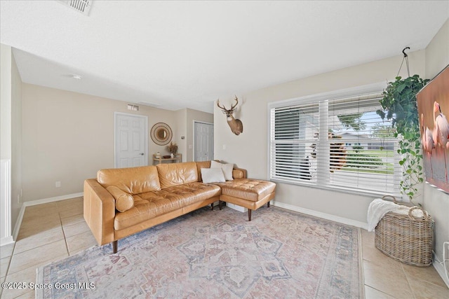 609 Tallwood Cir, Melbourne, FL 32904 - living area with light tile patterned floors and baseboards