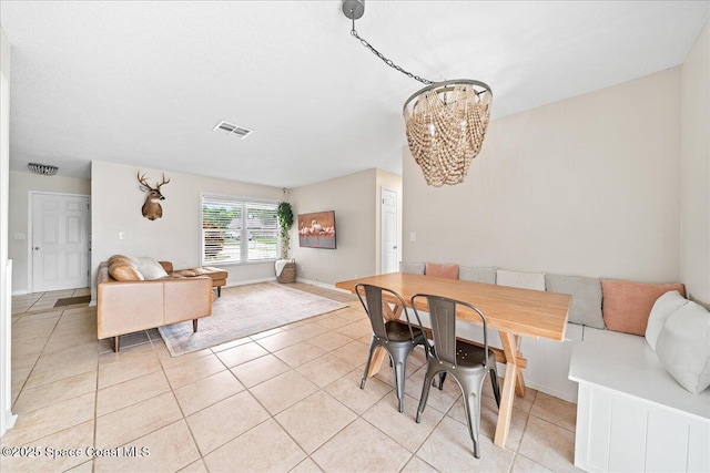 609 Tallwood Cir, Melbourne, FL 32904 - dining area featuring a chandelier and light tile patterned floors
