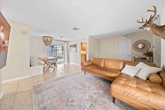 609 Tallwood Cir, Melbourne, FL 32904 - living room with light tile patterned floors and baseboards