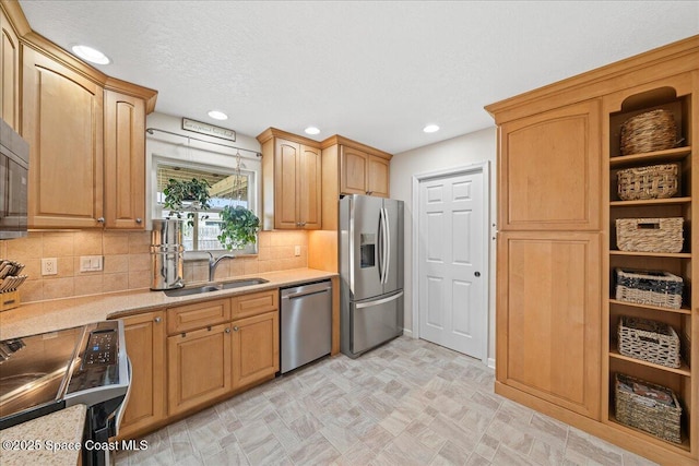 609 Tallwood Cir, Melbourne, FL 32904 - kitchen with appliances with stainless steel finishes, a sink, tasteful backsplash, recessed lighting, and light flooring