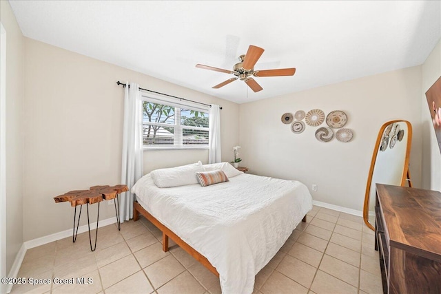 609 Tallwood Cir, Melbourne, FL 32904 - bedroom featuring light tile patterned floors, baseboards, and a ceiling fan