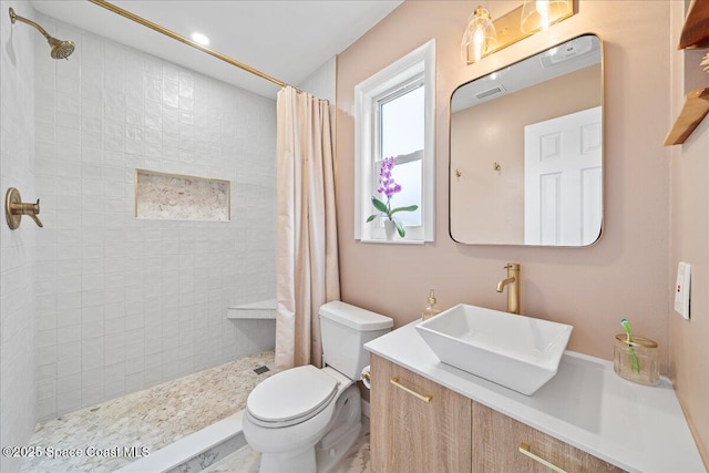 609 Tallwood Cir, Melbourne, FL 32904 - full bathroom with toilet, vanity, and a tile shower