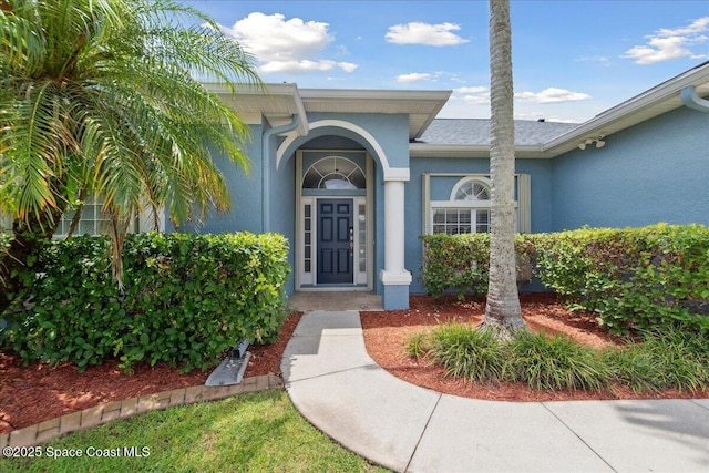 2465 Tuscarora Ct, Melbourne, FL 32904 - entrance to property with stucco siding