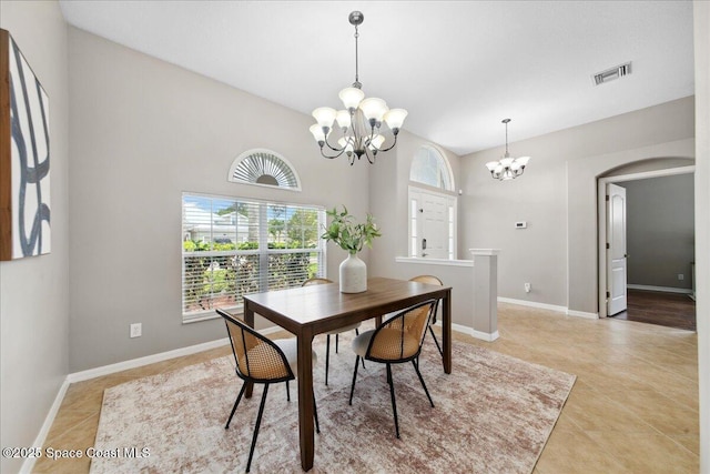 2465 Tuscarora Ct, Melbourne, FL 32904 - dining area featuring a chandelier, light tile patterned floors, and baseboards