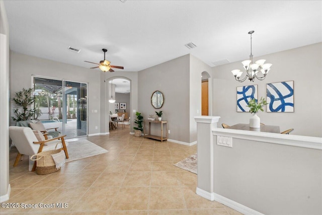 2465 Tuscarora Ct, Melbourne, FL 32904 - interior space with arched walkways, light tile patterned floors, a chandelier, and baseboards