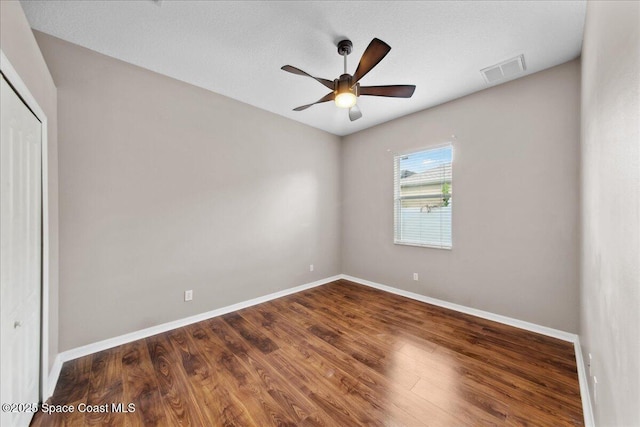 2465 Tuscarora Ct, Melbourne, FL 32904 - empty room with baseboards, ceiling fan, and wood finished floors