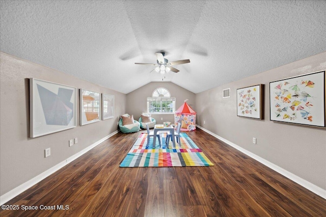 2465 Tuscarora Ct, Melbourne, FL 32904 - game room with ceiling fan, vaulted ceiling, wood finished floors, baseboards, and a textured ceiling