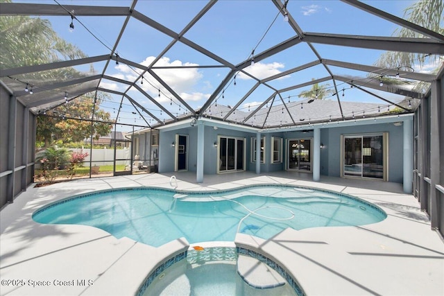 2465 Tuscarora Ct, Melbourne, FL 32904 - view of swimming pool with a patio area, a pool with connected hot tub, and a lanai