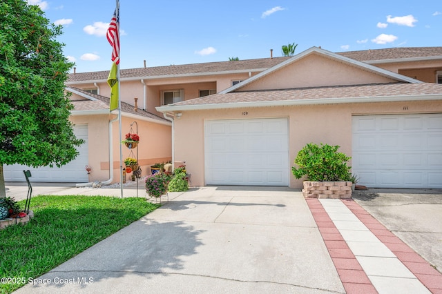 109 Plover Ln Unit 4-35, Rockledge, FL 32955 - view of property featuring stucco siding and driveway