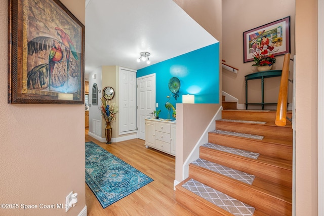 109 Plover Ln Unit 4-35, Rockledge, FL 32955 - staircase featuring wood finished floors and baseboards
