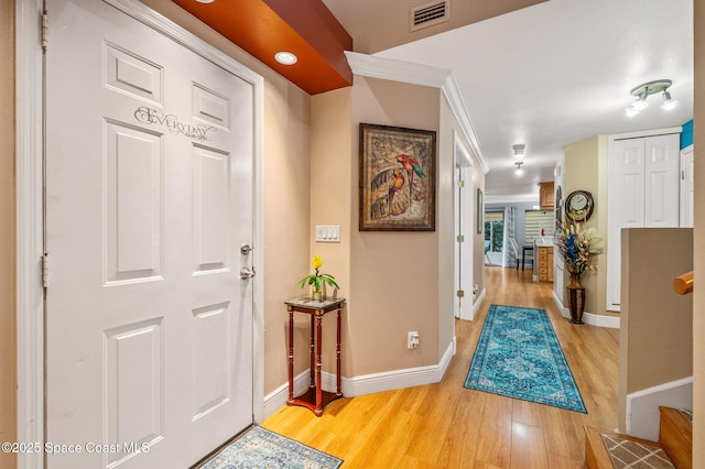 109 Plover Ln Unit 4-35, Rockledge, FL 32955 - entrance foyer with light wood-type flooring and baseboards