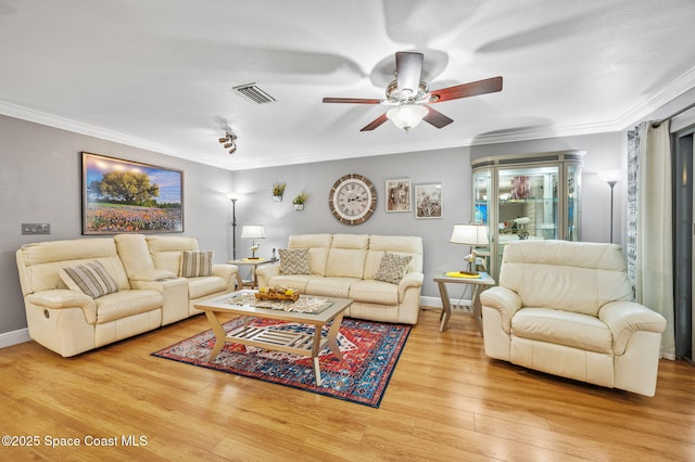 109 Plover Ln Unit 4-35, Rockledge, FL 32955 - living area with ceiling fan, light wood-style floors, crown molding, and baseboards
