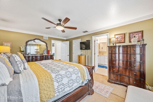 109 Plover Ln Unit 4-35, Rockledge, FL 32955 - bedroom featuring light colored carpet, crown molding, ceiling fan, ensuite bath, and a textured ceiling