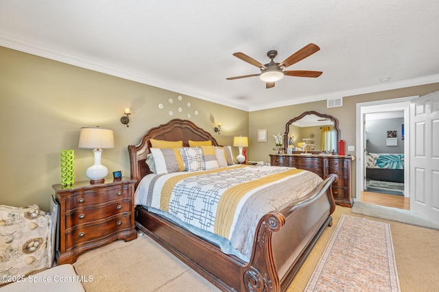 109 Plover Ln Unit 4-35, Rockledge, FL 32955 - bedroom featuring light carpet, ornamental molding, and a ceiling fan