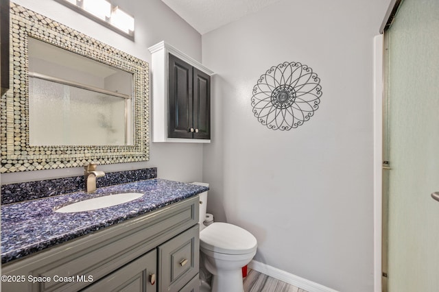 109 Plover Ln Unit 4-35, Rockledge, FL 32955 - full bath with toilet, a stall shower, vanity, and baseboards