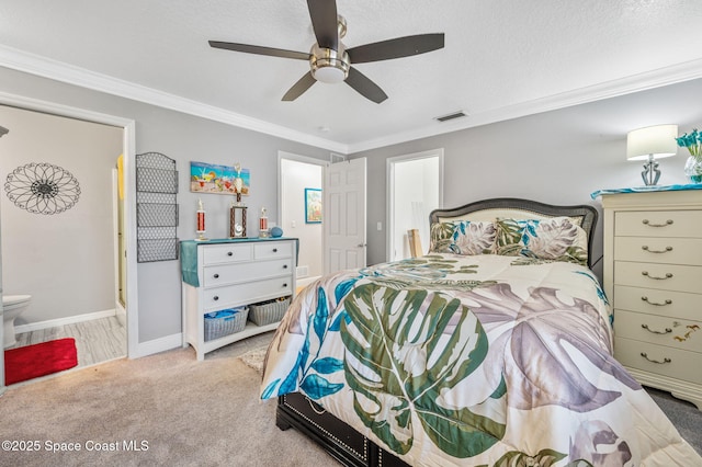 109 Plover Ln Unit 4-35, Rockledge, FL 32955 - bedroom featuring carpet, ornamental molding, baseboards, connected bathroom, and ceiling fan