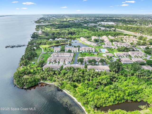 109 Plover Ln Unit 4-35, Rockledge, FL 32955 - aerial view of property and surrounding area with a nearby body of water and a tree filled landscape