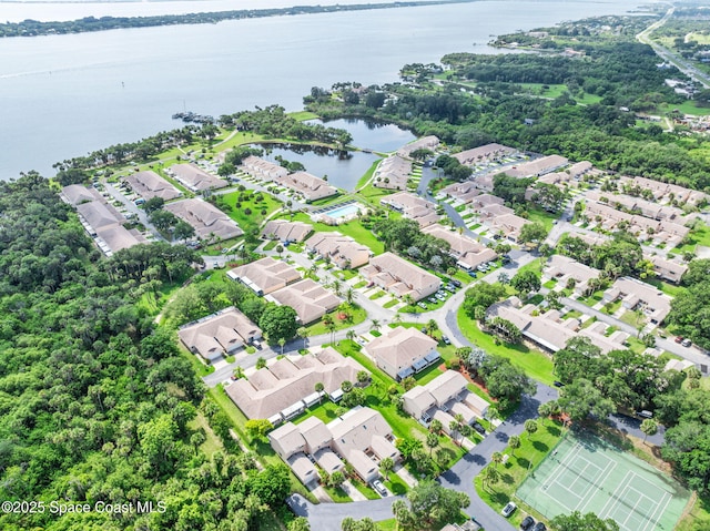 109 Plover Ln Unit 4-35, Rockledge, FL 32955 - aerial perspective of suburban area featuring a large body of water