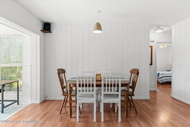 143 Cedar Ave, Cocoa Beach, FL 32931 - dining room with light wood-type flooring and baseboards
