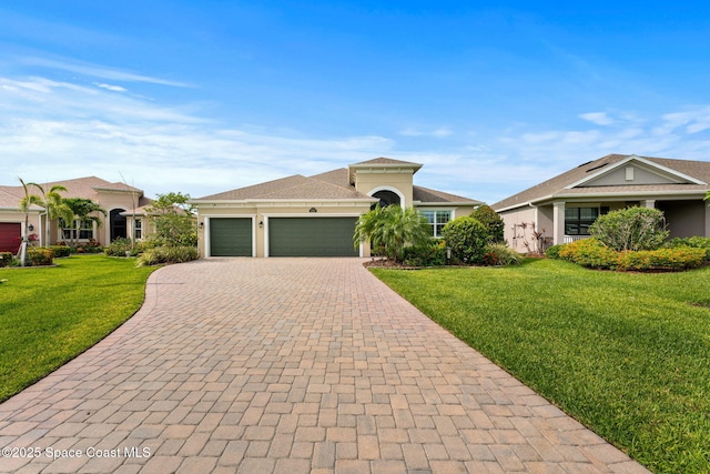 3387 Caviston Way, Melbourne, FL 32940 - view of front of house featuring decorative driveway, a garage, a front yard, and stucco siding