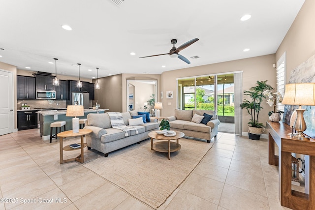 3387 Caviston Way, Melbourne, FL 32940 - living area with ceiling fan, recessed lighting, and light tile patterned floors