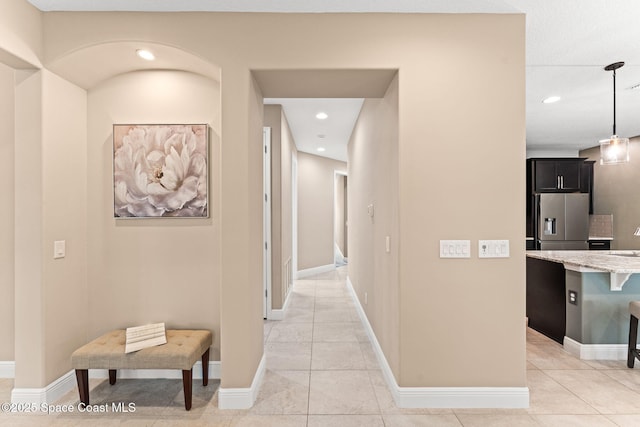 3387 Caviston Way, Melbourne, FL 32940 - hallway with recessed lighting, light tile patterned floors, and baseboards