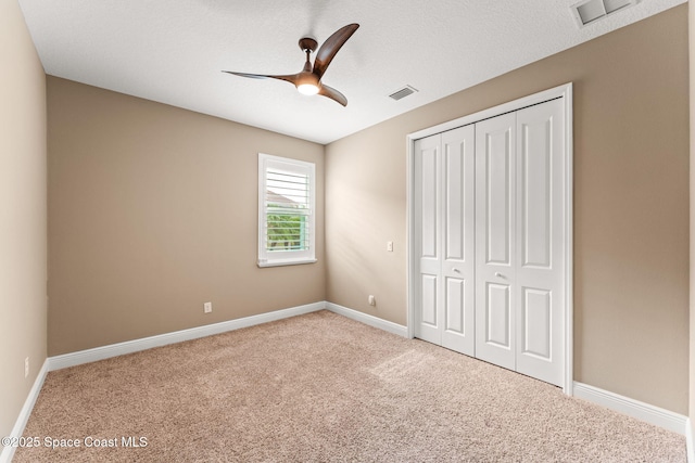 3387 Caviston Way, Melbourne, FL 32940 - unfurnished bedroom featuring carpet flooring, a closet, and baseboards