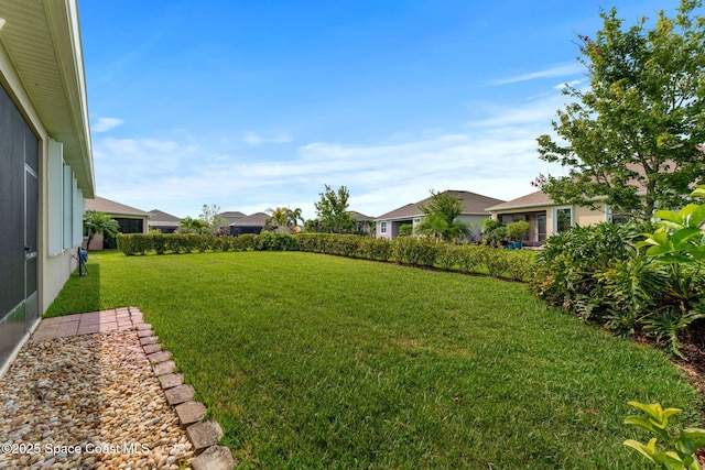 3387 Caviston Way, Melbourne, FL 32940 - view of green lawn with a residential view